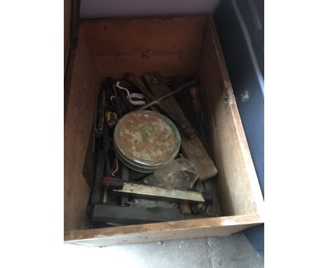 A PINE BOX WITH TOOLS