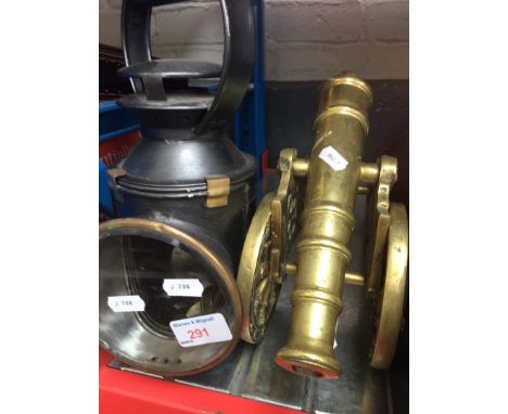 A RAILWAY LAMP AND A MODEL CANNON