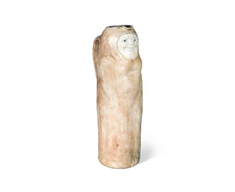 Robert Wallace Martin for Martin Brothers, a stoneware 'Eskimo' jug, circa 1910, of tall cylindrical form and modelled as a s
