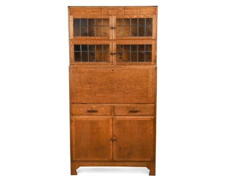 An Art Deco oak sectional bureau bookcase by Minty of Oxford,  with two glazed sections above a fall front bureau, a pair of 