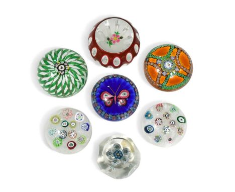 A collection of seven limited edition Perthshire glass paperweights, to include two weights with spaced millefiori florettes 