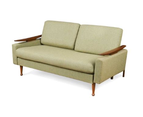 A Greaves &amp; Thomas teak sofa or day bed, circa 1950, with sculpted arms and backrail raised on tapering legs70 x 140 x 70