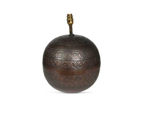 A copper table lamp,  of bulbous form embossed with bands of repeat geometric patterns38cm high to top of light fitting