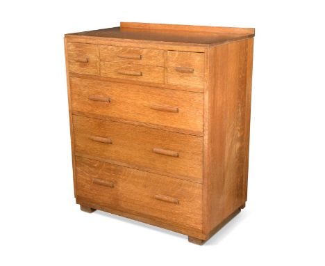 A Heal's oak 'Scotch' chest of drawers, circa 1930,  the rectangular top above an arrangement of four short drawers over thre