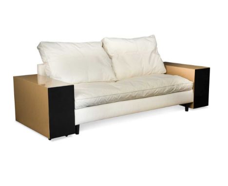 After Eileen Gray, (1878-1976), a `Lota` sofa,  originally designed 1924 and later reissued, lacquered sides with cream uphol