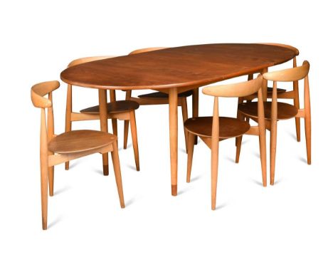 § Hans Wegner for Fritz Hansen, a teak and beech dining table and six chairs,  the oval extending table raised on tapering cy