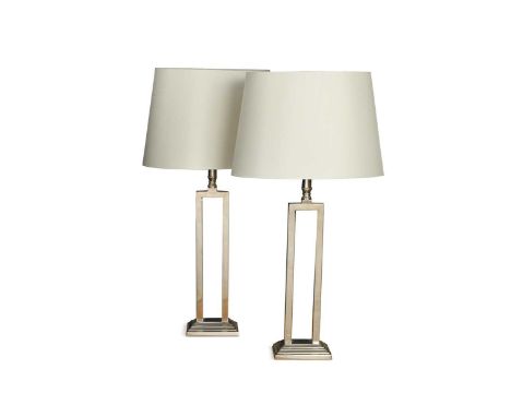 A pair of modern chrome table lamps,  the open rectangular columns with cream shades54cm to top of light fitting