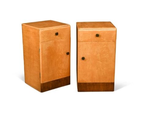 A pair of Art Deco blonde birdseye-maple bedside cabinets, each with a single drawer above a cupboard door, with mottled bake