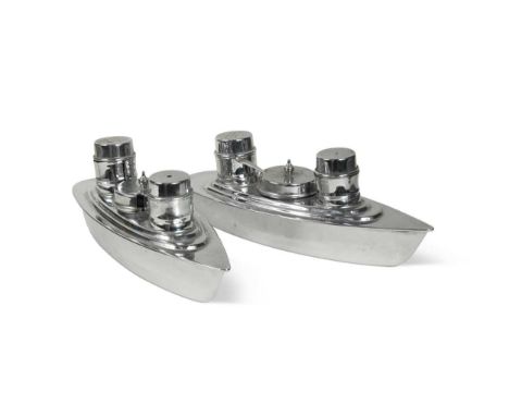 A pair of Art Deco chromium plated cruet sets,  each in the form of an ocean liner and comprising a salt, pepper, and mustard