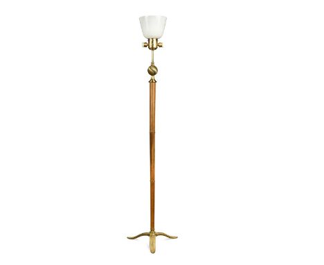 A mid-century standard lamp, the three-light lamp holder above a wrythen sphere and stained beech stem with a three-pronged b