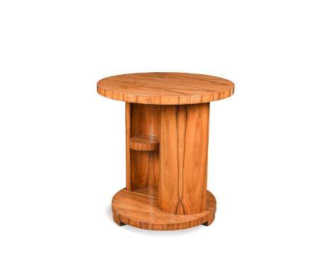 An Art Deco walnut centre table,  the circular top on 'S'-shaped support with shelf to either side, raised on a circular base