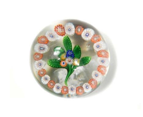 A St Louis garlanded bouquet paperweight, the central nosegay comprising five millefiori blooms upon an arrangement of five c