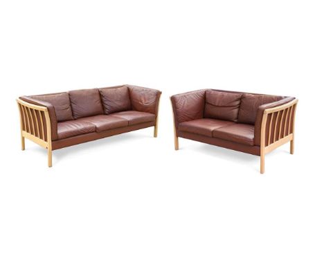 Stouby, a Danish conker brown leather three-seat sofa and another two-seat sofa, each with loose leather cushions and slatted