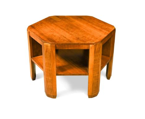 An Art Deco quarter-sawn walnut coffee table in the manner of Heal's, circa 1930, the hexagonal top and undertier raised on f