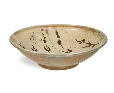 § Jim Malone (1946-), a large stoneware footed dish, the interior brushed with hakeme slip and decorated with a repeating mot