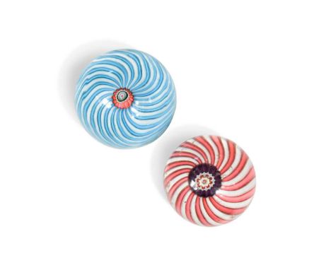 Two Clichy swirl paperweights, the larger with a radiating pinwheel of blue and white staves emerging from the central pink, 