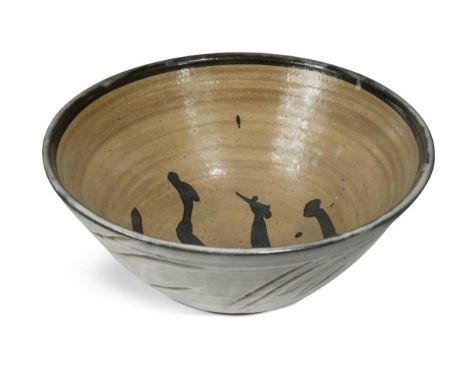 § William Marshall (1923-2007), a large stoneware bowl, the exterior with brushed slip over a tenmoku glazed ground and embel