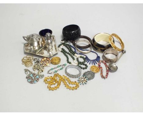 A large collection of various pieces of costume jewellery, to include; a silver and amber necklace, two silver bangles, silve