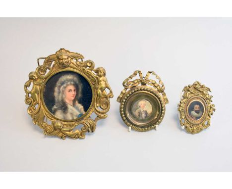 Three various brass framed portrait miniatures, 19th century and later, the first Continental school of a young lady, oil on 