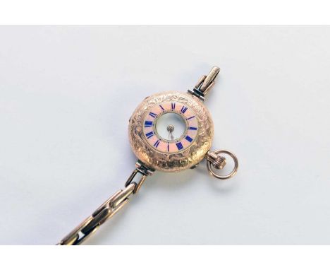 A continental yellow metal and enamel half hunter fob watch, the white enamel dial with black Roman numerals, with attached g