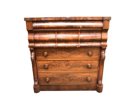 A Victorian mahogany Scotch chest of drawers, the plain top with break front above a concealed ogee frieze drawer, three ogee