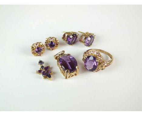 A 9ct gold amethyst dress ring, together with a 9ct gold amethyst and diamond pendant, a further 9ct gold amethyst set pendan