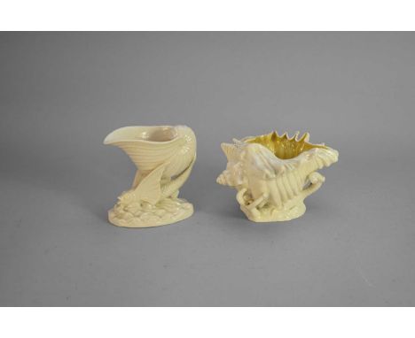 Two Belleek shell vases, First Period (1863-90)comprising a Flying Fish vase, modelled as a winged fish with a nautilus shell