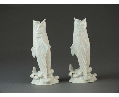 A pair of Belleek First Period spill vases in the form of fishlate 19th centurymodelled vertically posed with open mouths, st