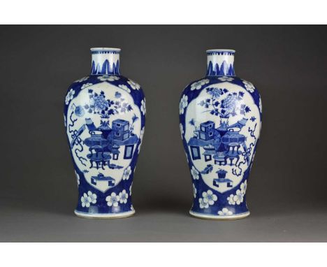 A pair of Chinese blue and white baluster vases, Kangxi six-character marks, probably QianlongOf ovoid form with narrow rims,