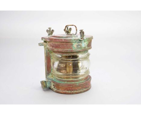 A copper ship's lantern, 17cm high, together with a wood rigging block, 8cm. (2)Condition report: Lamp has no electric fittin