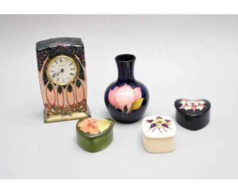 A small group of Moorcroft20th/21st contemporarycomprising a 'Cluny' mantel clock, 15.5cm high; a heart-shaped trinket box an