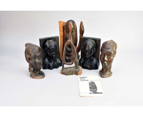 Two modern Makonde wood sculptures, Mozambique, East Africa, the first modelled as an elongated head with a zoomorphic projec