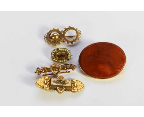 An oval orange hardstone brooch, within yellow metal mount, stamped '9ct', together with a 9ct gold heart bar brooch, two yel