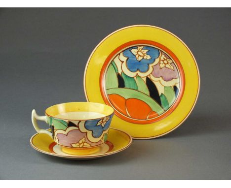 Clarice Cliff for Newport potterya trio in the 'Orange Gardenia' pattern, comprising teacup, 10cm diameter, saucer and side p