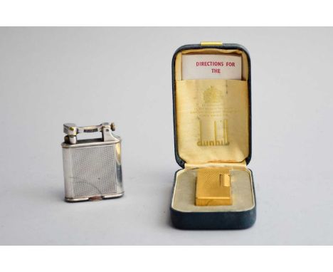 A Dunhill 'Rollagas' yellow metal cigarette lighter, with engine-turned chequered design, in box with instruction book, 6.5cm