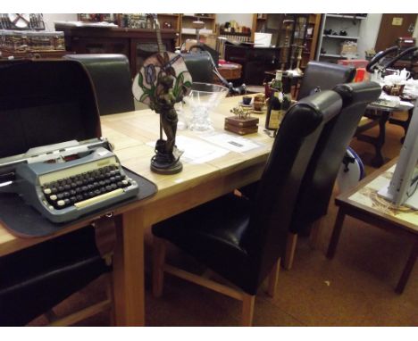 Good quality light oak dining table with floating panel top, with six leatherette high back dining chairs 