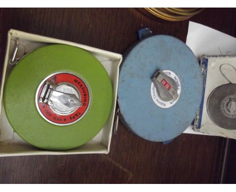 Two vintage tape measures 