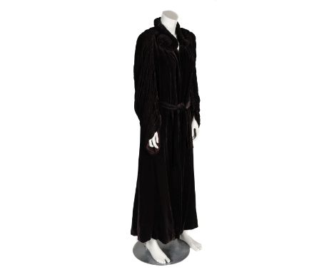 * Clothing. An Art Deco velvet opera coat, 1930s, a plum velvet unstructured full-length evening coat, with padded and ruched