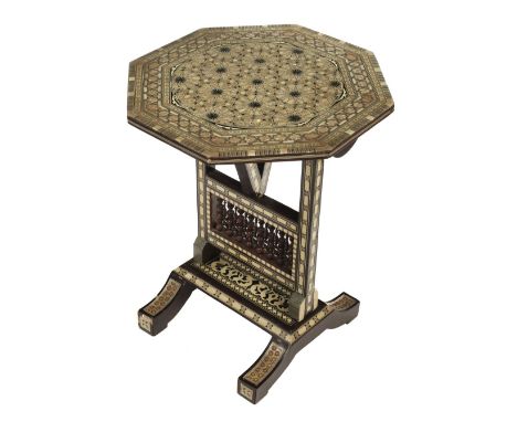 * Moorish Table. An early 20th century inlaid octagonal occasional table, profusely inlaid with mother of pearl and bone, the