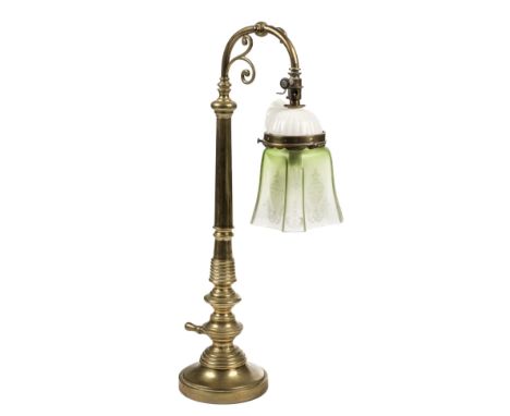 * Lighting. An Art Nouveau brass table lamp, with a green glass shade, 50.5cm highQty: (1)