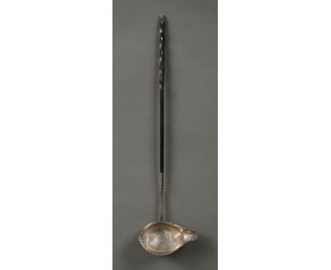 * Toddy Ladle. A George III period silver toddy ladle, the bowl with engraved decoration, twisted wooden handle with small si
