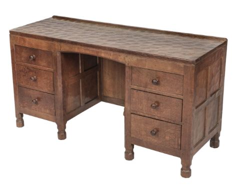 * Mouseman. A Robert "Mouseman" Thompson of Kilburn (1876-1955), oak pedestal desk, the kneehole flanked by 3 drawers each wi