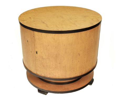 * Art Deco. A cocktail cabinet attributed to Ray Hille circa 1930, of circular form veneered in birdseye maple, the hinged do