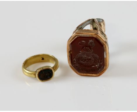 19th C intaglio flower ring, in yellow metal testing as 15 ct,with a concealed hinged section revealing plaited hair in shank