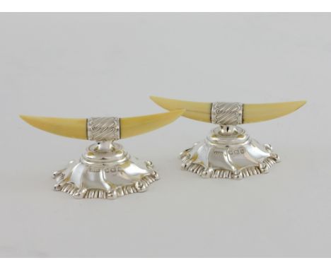 Pair of silver and ivory knife rests, modelled as animal horns on shaped gadrooned bases, by James Dixon & Sons, Sheffield, 1