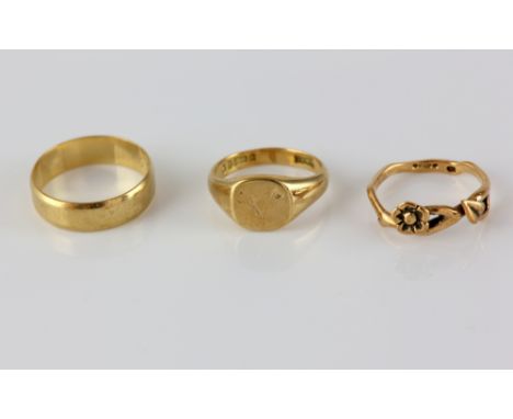 Three vintage gold rings, signet ring, square head engraved with 'V', hallmarked London 1969, size K, with a flower ring, siz