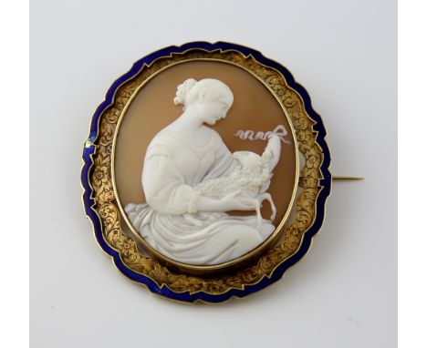  Fine Victorian cameo brooch, oval shell cameo depicting St Agnes and the lamb, surrounded by engraved floral border and blue
