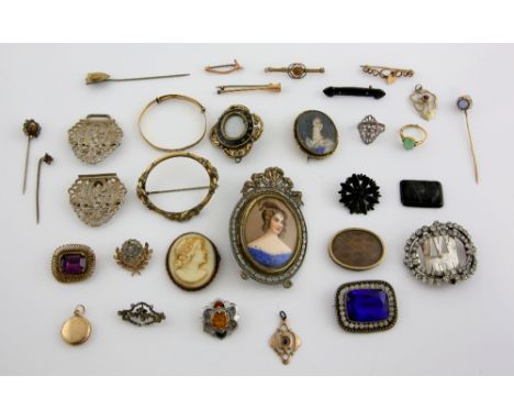 A group of mainly antique jewellery, Victorian black enamel and gilt metal memorial brooch, ceramic portrait of a lady,  an o