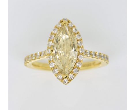 Fancy pale yellow marquise form diamond ring, the central stone estimated at 2.01 carats, clarity vvs, within a border of dia