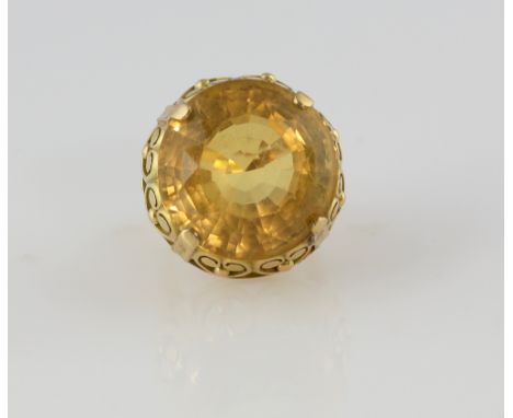 Vintage citrine cocktail ring, round cut stone, estimated weight 34.43 carats, mounted in ornate yellow metal setting, stampe